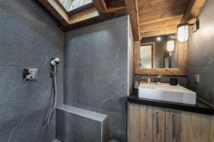 a bathroom with a sink and a shower at Perfect for moments with friends or family in Oberstaufen