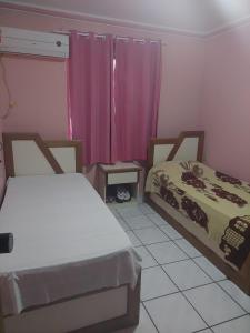 Un pat sau paturi într-o cameră la Villa Saudade