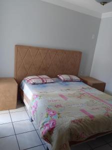 Un pat sau paturi într-o cameră la Villa Saudade