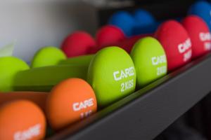 a row of different colored balls on a shelf at Golden Tulip Porto-Vecchio in Porto-Vecchio
