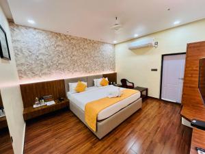 Letto o letti in una camera di Shankar Bhavan By Vinayak Hotels