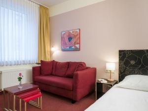 Postel nebo postele na pokoji v ubytování Hotel Aigner
