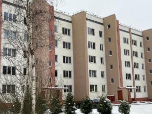 an apartment building with snow on the ground at Roja Lux Apartment in Roja