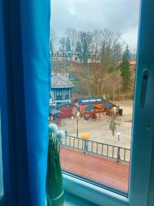 a view of a playground from a train window at Apartamenty i Pokoje Gościnne ALA II in Szklarska Poręba