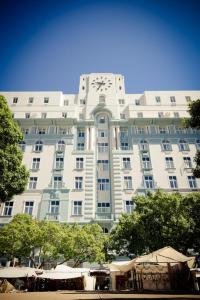 a large building with a clock on the front of it at ONOMO Hotel Cape Town – Inn On The Square in Cape Town