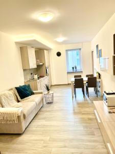 a living room with a couch and a table at TIME TO ESCAPE in Tirano +9 photos