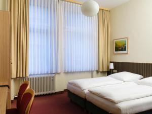 Postel nebo postele na pokoji v ubytování Hotel Aigner