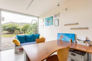 a dining room with a table and a couch at Eco Suites Caves in La Laguna