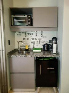 a kitchen with a sink and a counter top at InspireBA - Garden in Buenos Aires