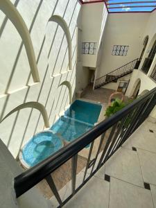 Bazén v ubytování Hotel Doña Chela En Calvillo nebo v jeho okolí