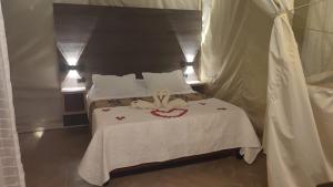 Postel nebo postele na pokoji v ubytování Glamping Paraíso Escondido