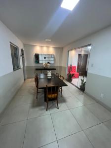 a dining room with a table and chairs at Hangar House in Belém