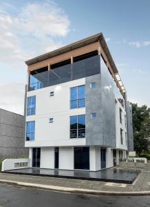 a large white building with glass windows at Piedra Luna in Cali