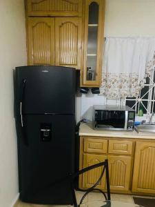 Dapur atau dapur kecil di Club Caribbean Apartments