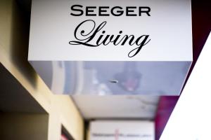 a picture of a room with the words secret living at SEEGER Living Comfort Downtown in Karlsruhe