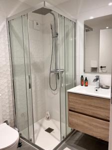 a bathroom with a shower and a toilet and a sink at Vexin Studio in Chaumont-en-Vexin