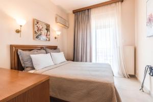 Postel nebo postele na pokoji v ubytování Alkyonis Hotel + 37 fotografií