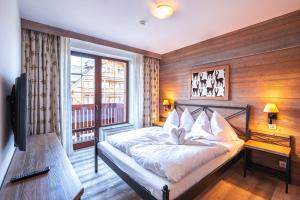Ein Bett oder Betten in einem Zimmer der Unterkunft Kukučka Lomnica - Tatranská Lomnica