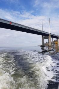 a bridge over a body of water with waves at Cosy 2 Bedroom Croft Cottage with Beautiful Views in North Kessock