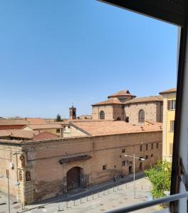 a view of a city from a window at D'AZEGLIO 62 LUXURY ROOMS in Bologna