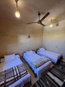 Postel nebo postele na pokoji v ubytování Agpeninshal Ecolodge