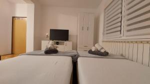 Postel nebo postele na pokoji v ubytování Studio apartman Kod vodotornja