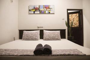 Katil atau katil-katil dalam bilik di Gem Light Guest House