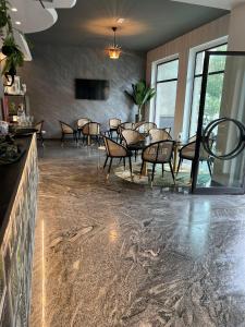 a dining room with a table and chairs at ALBERGO 900Strati in Bergamo