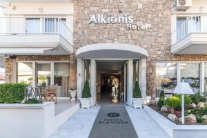 a store front with a sign that reads athens hotel at Alkyonis Hotel in Nea Kallikrateia