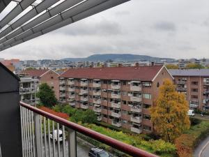 a view from a balcony of an apartment building at Spacious and cozy study apartment with balcony in Oslo
