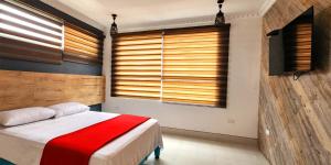 Voodi või voodid majutusasutuse Hotel Murali - Cerca del Aeropuerto de Guayaquil toas