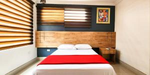 Voodi või voodid majutusasutuse Hotel Murali - Cerca del Aeropuerto de Guayaquil toas