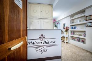 a dressing room with a museum bureau sign on the door at Maison Bianca B&B in Florence