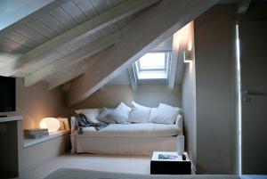A bed or beds in a room at Albergo Silvio