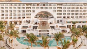 an aerial view of a hotel with a pool and palm trees at Marquis Los Cabos, an All - Inclusive, Adults - Only & No Timeshare Resort in San Jos&eacute; del Cabo