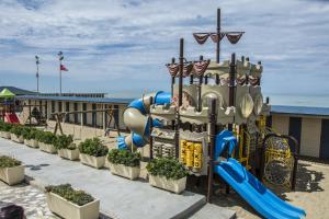 a playground on the beach with a slide at Hotel Riviera Blu in Tirrenia