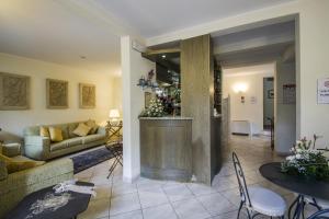 a living room with a couch and a table at Hotel Riviera Blu in Tirrenia