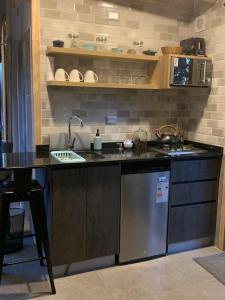 a kitchen with a sink and a counter top at Cabaña Romántica in Cunco