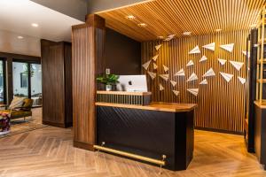 a lobby with a desk with white paper on the wall at The Darwin Hotel in Atlanta