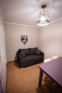 a living room with a couch and a table at Samay Departamentos in Salta