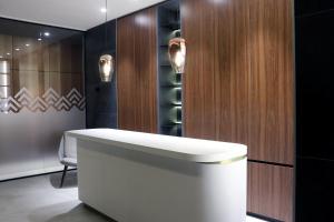 a bathroom with a sink and a wine cellar at Superior Woodside Residences & Spa Kopaonik in Kopaonik +43 photos