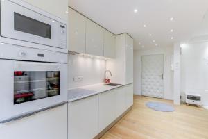 Kuchyňa alebo kuchynka v ubytovaní Appartement Standing à Toulouse en centre ville + 34 fotografií