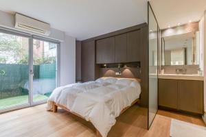 Posteľ alebo postele v izbe v ubytovaní Appartement Standing à Toulouse en centre ville