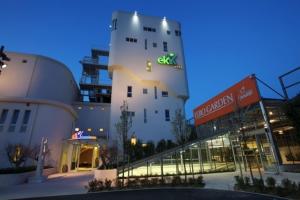 a white building with a sign on the side of it at Ekk Hotel in Citta' Sant'Angelo