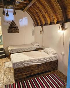 a bedroom with two beds in a room at Dream house in Dahab