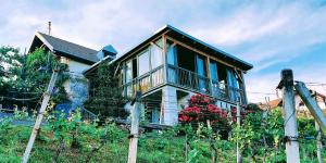 a house with a fence in front of it at Studio in Novo mesto - dostava - Kranjska Krain 26035 in Mačkovec pod Trško Goro