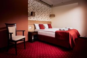 Posteľ alebo postele v izbe v ubytovaní Hotel Maraton