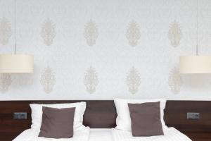 Posteľ alebo postele v izbe v ubytovaní Hotel Maraton