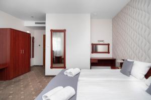 Posteľ alebo postele v izbe v ubytovaní Hotel Maraton