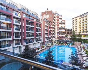 an apartment complex with a swimming pool and buildings at ADMIRAL PLAZA C 43 Studio Sunny Beach in Sunny Beach